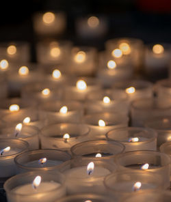 Votive candles lit in church