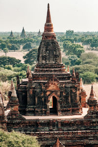 Old temple building against sky