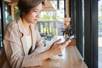 Young woman using mobile phone