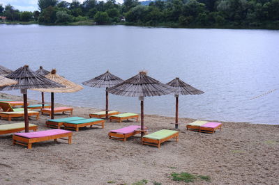 Chairs on beach against sea