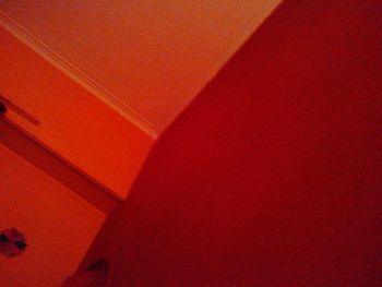 Low angle view of red wall