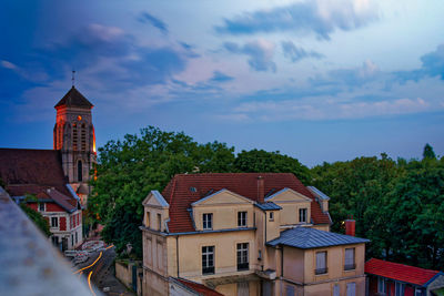 Houses and buildings against sky