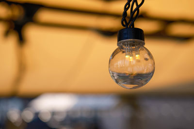 Close-up of illuminated light bulb