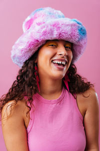 Portrait of young woman wearing hat