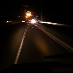 Light trails on road at night