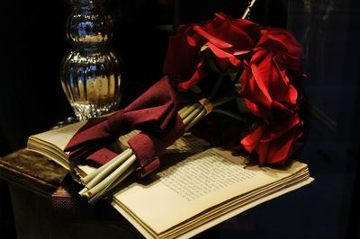 Close-up of red rose on table