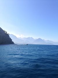 Scenic view of sea against clear blue sky