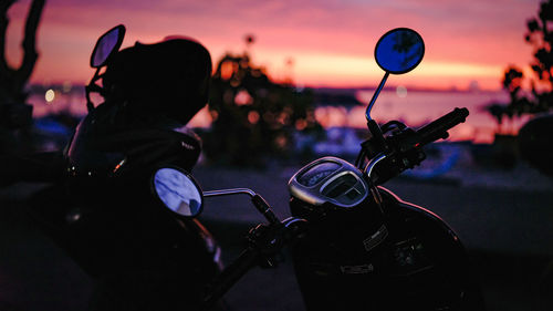 Close-up of motorcycle on street during dusk