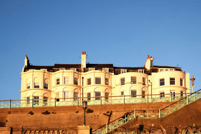 Low angle view of buildings against blue sky