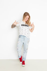 Woman standing against white background