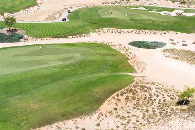 View from above people playing golf