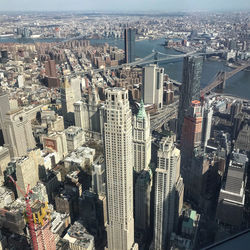 High angle view of modern buildings in city against sky