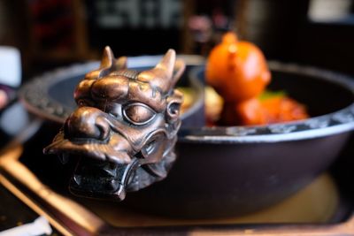 Close-up of statue in bowl