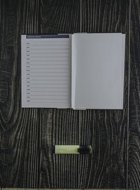 Directly above shot of diary with pen on table