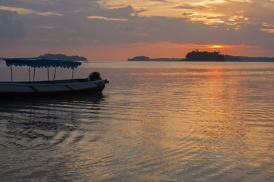 Scenic view of sea against orange sky