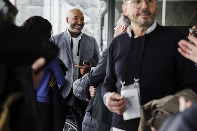 Multiracial business delegates discussing during seminar at conference center