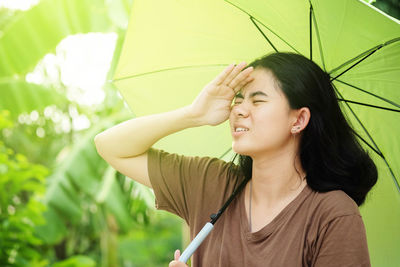 Portrait of young woman looking away