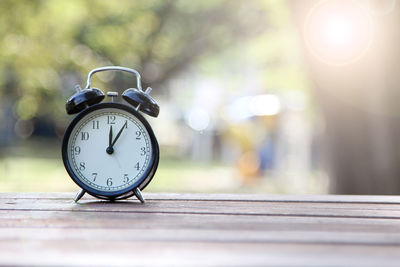 Close-up of alarm clock on table