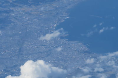 Aerial view of snowcapped mountain against sky