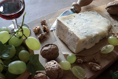 Blue cheese with walnuts, grapes. gorgonzola cheese.