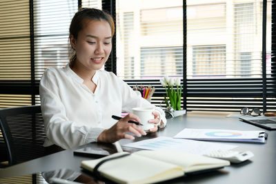 Portrait of businesswoman working at office