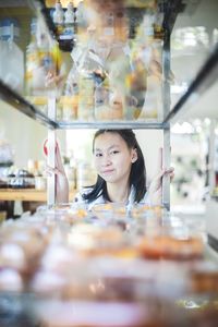 Portrait of a woman looking at store