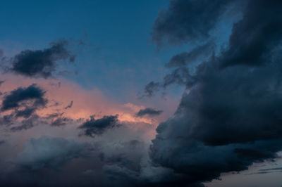 Low angle view of clouds in sky during sunset