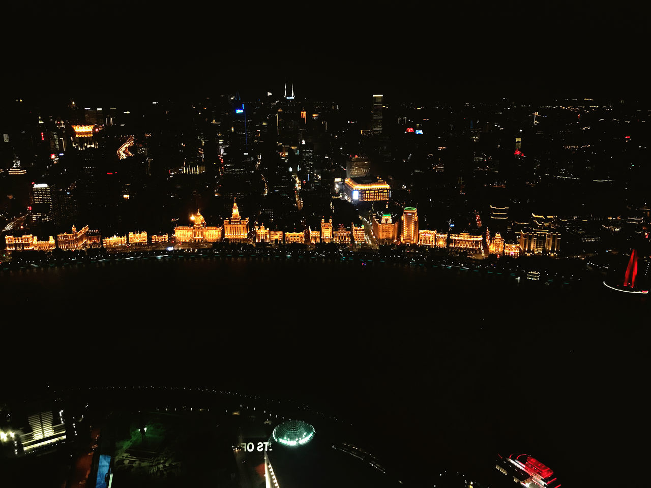 HIGH ANGLE VIEW OF ILLUMINATED BUILDINGS AGAINST SKY AT NIGHT