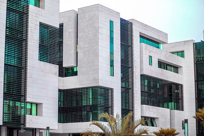 Low angle view of modern buildings against sky in city