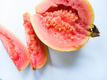 Close-up of strawberry slices over white background