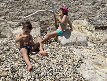 High angle view of friends on rock