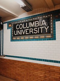 Text on wall at subway station