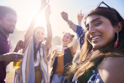 People enjoying drinks against sky