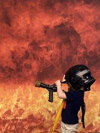 Full length of man holding umbrella