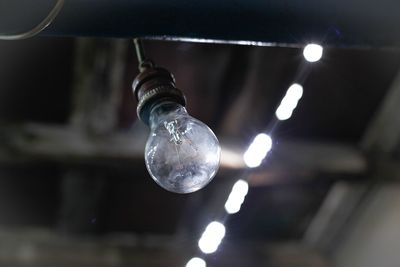 Low angle view of illuminated light bulb