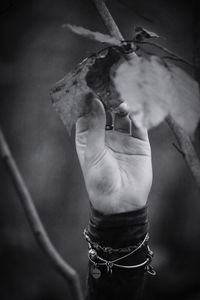 Close-up of man holding hand