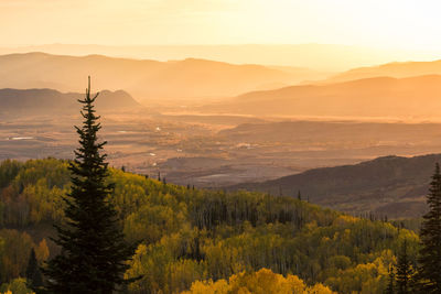 Scenic view of landscape against sky during sunset