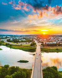 High angle view of river against sky at sunset