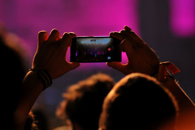 Close-up of woman holding smart phone