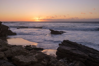 Scenic view of sea against sky during sunset