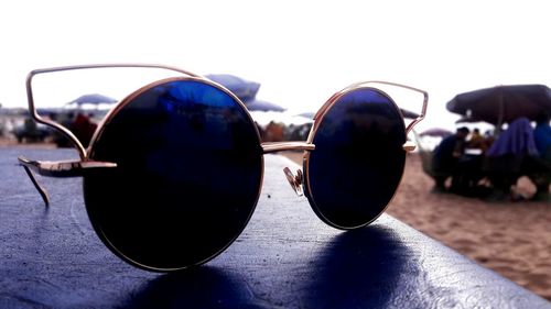 Close-up of sunglasses against clear sky