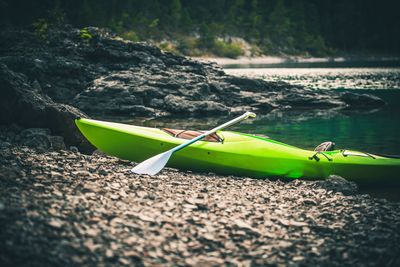 Kayak moored at riverbank