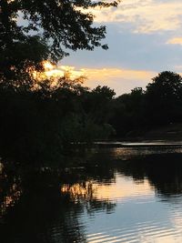 Scenic view of river at sunset