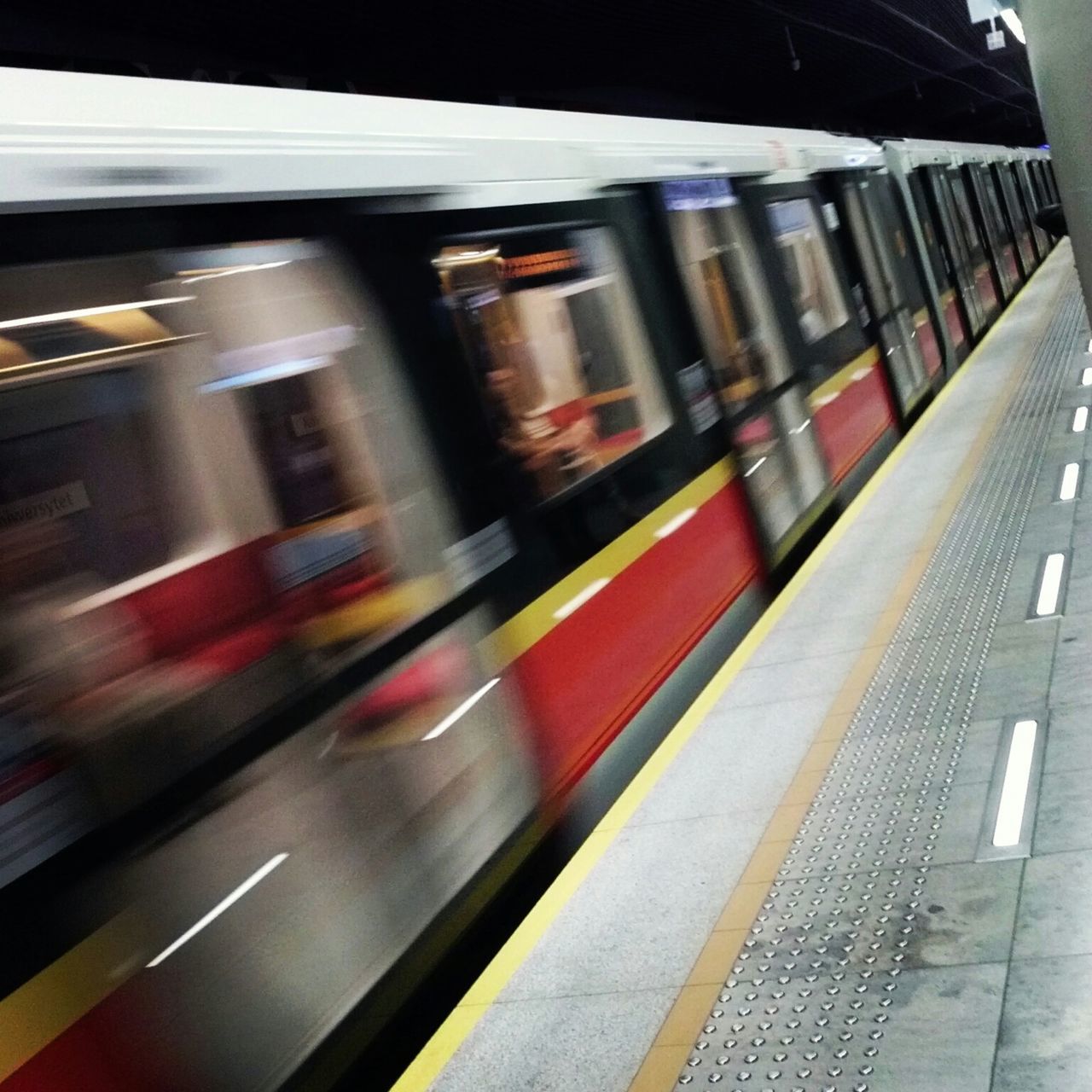 transportation, mode of transport, public transportation, land vehicle, railroad station, on the move, travel, railroad station platform, rail transportation, train - vehicle, motion, indoors, railroad track, passenger train, car, blurred motion, speed, subway station, train, journey