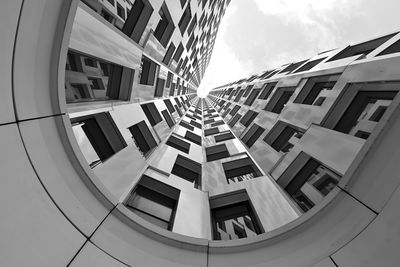 Directly below shot of modern buildings against sky