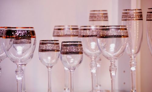 Close-up of wine glasses on table