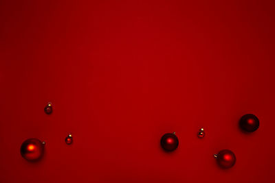 Full frame shot of water drops on red wall