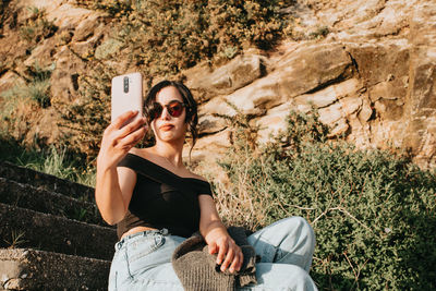 Young woman using mobile phone