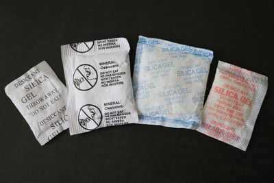 High angle view of text on paper against black background