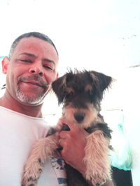 Portrait of man with dog